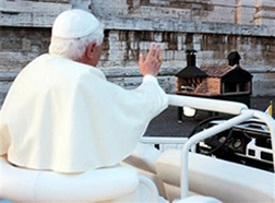 Pope Benedict blesses pizza ovens used for feeding the poor.